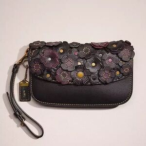 Coach black and oxblood tea rose clutch